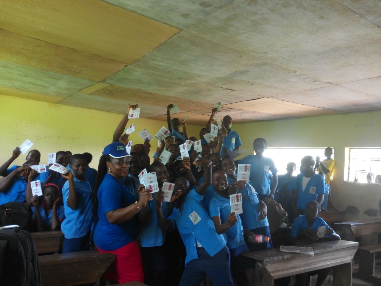 Joyful students with leadership books